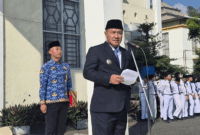 Wali Kota Alfin membacakan sambutan Menteri Komunikasi dan Digital RI, Meutya Viada Hafid