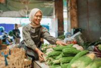 Perempuan muslim sedang berjualan sayuran. (Foto: Magnific)