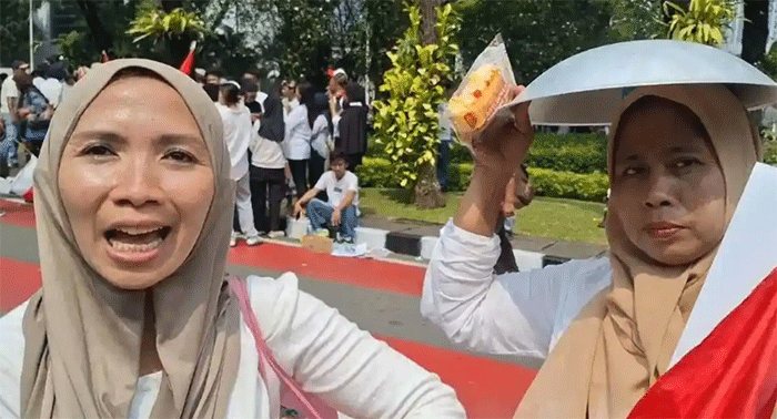 Aksi unjuk rasa mendukung Program Makan Bergizi Gratis (MBG) digelar di kawasan Monumen Nasional (Monas), Jakarta Pusat, Senin (22/6/2026). 