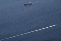 Foto: Perahu-perahu di Selat Hormuz di tengah konflik AS-Israel dengan Iran, seperti yang terlihat dari Musandam, Oman, 2 Maret 2026. (REUTERS/Amr Alfiky)