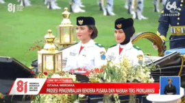Nindya Eltsani Fawwaz, saat bertugas membawa bendera pusaka Merah Putih menaiki Kereta Kencana Garuda Prabayaksa. Tangkapan Layar
